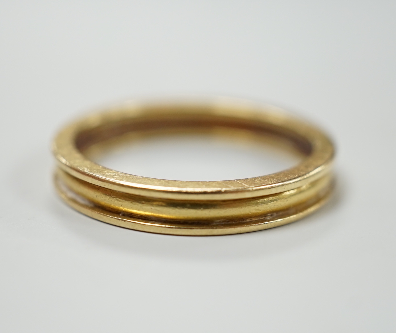 A modern Theo Fennel 18ct gold band, size R, gross weight 4.8 grams.